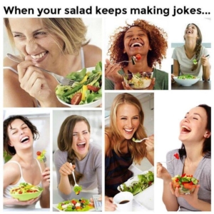 women smiling with salad