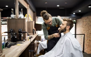 Client During Beard Shaving in Barber Shop