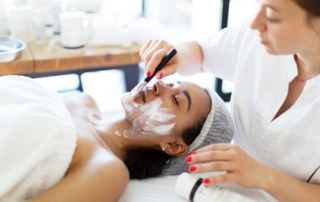 Cosmetologist making face massage